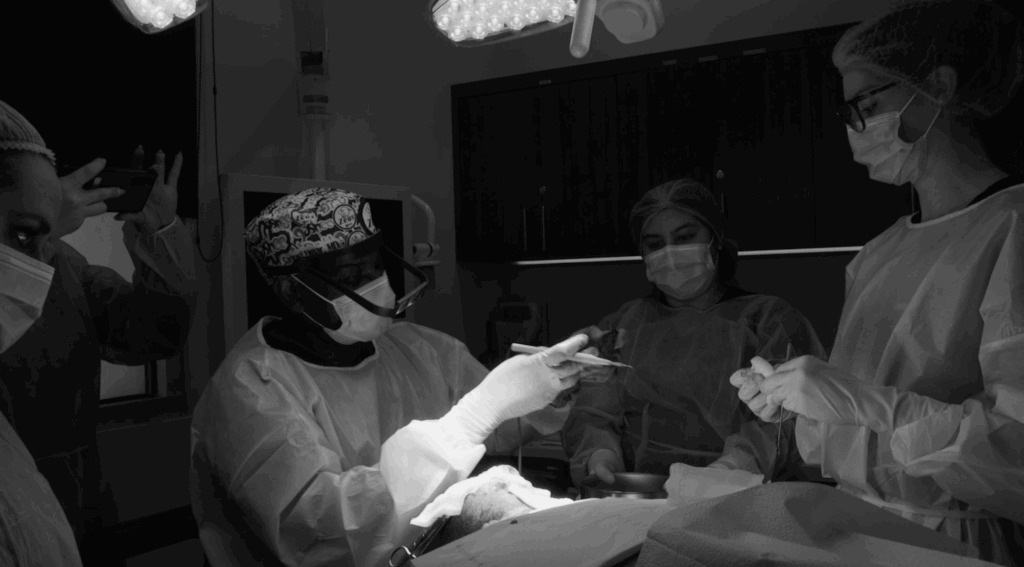 Dr. Sanusi Umar is removing a 16-year-old scalp keloids using the Athena Suture Kit during Anwar’s surgery.