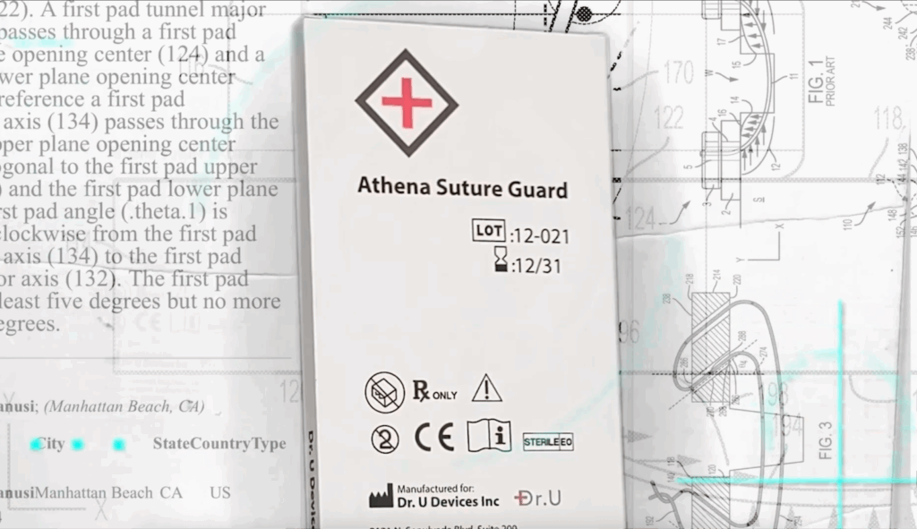 Close-up of the Athena Suture Guard medical packaging featuring a red cross logo, designed by Dr. Umar for high-tension scalp closures. Image caption: The Athena Suture Guard, designed by Dr. Umar for complex scalp reconstruction.