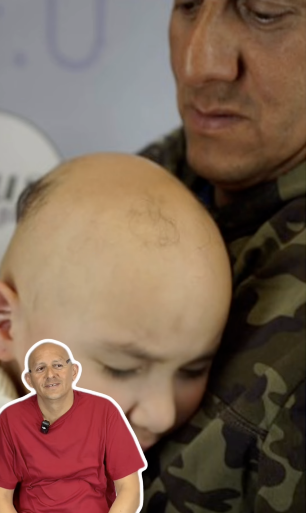 A child with a closely shaved scalp being held by an adult, with an inset image of a man in a red shirt.